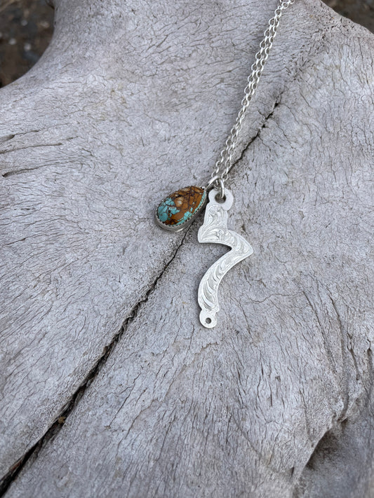 7 Cheek Charm necklace